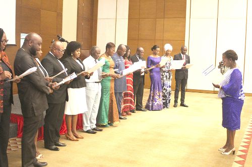 Mrs Elane Sam (right), President of the Institute of Public Relations Ghana, inducting the members into office. Picture: GABRIEL AHIABOR
