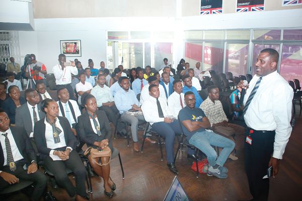  Mr Frankline Sowa (right), Director, Marketing, addressing students before the start of the competition
