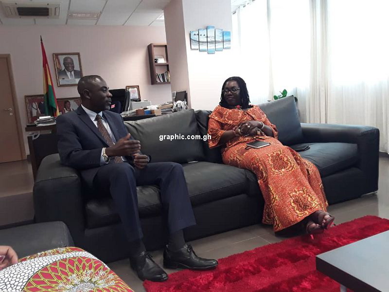 The Rector of GIJ, Professor Kwamena Kwansah-Aidoo explaining a point to the Minister of Communications, Mrs Ursula Owusu-Ekuful.