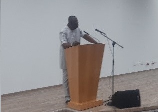 Mr Lawrence Agyinsam (left) addressing staff of the Ghana Export-Import Bank (GEXIM) at the Export Trade House in Accra