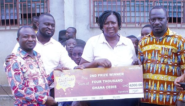  (From left) The Ashaiman West Circuit Supervisor, Mr Elisha Akobilla; the Marketing Director of FanMilk Ghana Limited, Mr Edwin Amoako; the Headteacher of the St Augustine R/C  School, Mrs Rita Akankpiewen, and the Headteacher of the SDA School, Mr Nicholas Nii Kpakoe,  displaying the dummy cheque.
