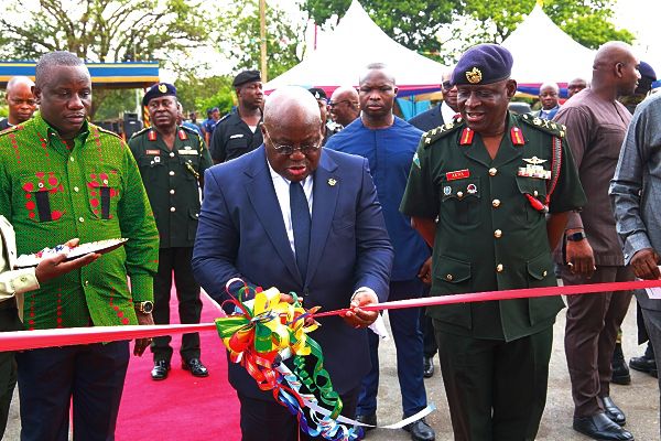 President Akufo-Addo cutting the ribbon to commission the new vehicles for the Ghana Armed Forces at the Burma Camp in Accra