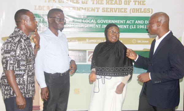 Ms Victoria Adongo (2nd right) interacting with some participants after the opening ceremony. Among them are Mr Joseph Ankamah (right), Mr Prosper Ahalivor (3rd left), Policy Planning, Budgeting, Monitoring and Evaluation Directorate, both of LGS and Mr Charles Nyaba, Head of Programme and Advocacy, PFAG,. Picture: Maxwell Ocloo