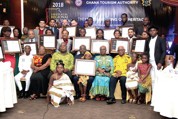Mr Ishmael Ashitey (seated 3rd left), Greater Accra Regional Minister  and Mr Akwasi Agyeman (4th left) with some invited guests and awardees after the awards ceremony in Accra. Picture: BENEDICT OBUOBI