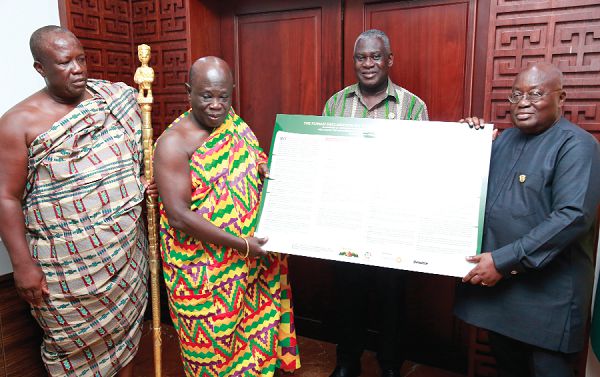 President Akufo-Addo (right) receiving the Kumasi Declaration on the SDG from Nana Effah Apenteng (2nd left), Bompata Manhene. Looking on is Dr Eugene Owusu (2nd right), Special Advisor, SDGs. Picture: SAMUEL TEI ADANO