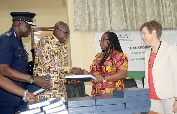 Mr Ambrose Dery (2nd left) presenting the book to Dr Margaret Amoakohene (2nd right), Member of the Council of State after the launch. Those looking on include Mr David Asante-Appeatu (left) and Ms Diana Acconcia (right), Head of the European Union Delegation in Ghana. Pictures: GABRIEL AHIABOR