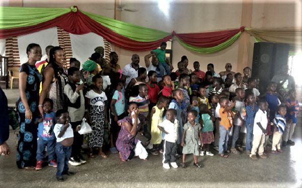 Mr Michael Annan (arrowed) with the children and some of the teachers