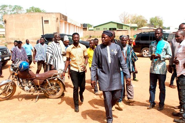 Mr Salifu Sa-eed (inset) leading the delegation to inspect a two storey building