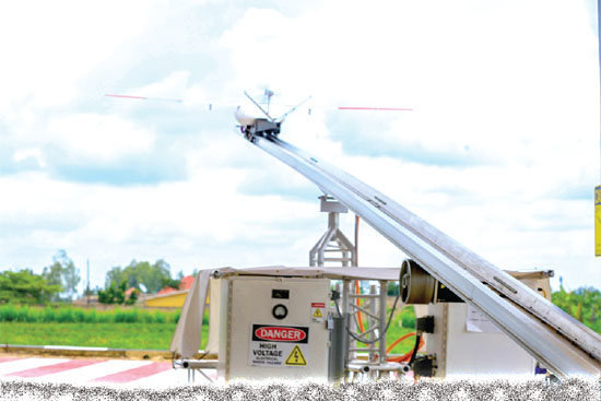 A drone (arrowed) taking off from a launcher to deliver blood. This service will be free for patients and medical facilities