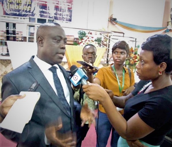  Rev. Prof.  Paul Frimpong-Manso (left) speaking to the media after the launch of the 50th anniversary celebration of the Ghana Pentecostal and Charismatic Council