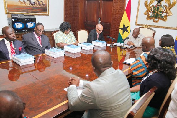 Mr Justice Emile Short (3rd left), the Chairman of the Ayawaso West Wuogon Commission of Enquiry, briefing President Nana Addo Dankwa Akufo-Addo on the commission’s report at the Jubilee House. Picture: SAMUEL TEI ADANO