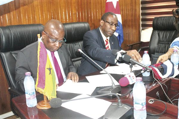  Mr Kwaku Agyeman-Manu (left) with Mr Pedro Luis Despaigne (right) signing the MoU.    Picture: Mercy Amparbeng