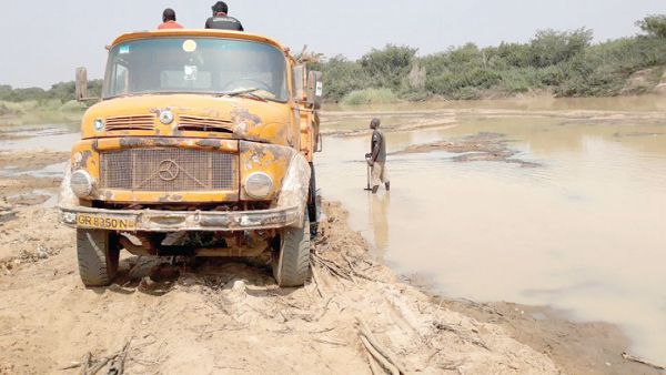 A Tipper truck conveying sand from the riverside