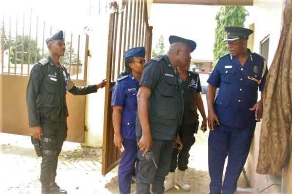 DCOP Patrick Adusei Sarpong (right), Chief Superintendent of Police Mr Kwesi Ofori (2nd right) and other police officers from the Accra Regional Police Command assessing the security situation at the Glorious Word and Power Ministries International at Odorkor, Accra
