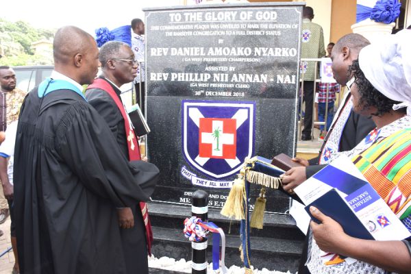 Rev. Daniel Nyarko (left) and Rev. Emmanuel Awaitey Anneh (2nd left) and other members of the church admiring the plaque