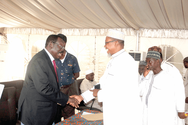 Sheikh I.C. Quaye (left), Chairman of the National Hajj Board, exchanging pleasantries with some participants after the thanksgiving service
