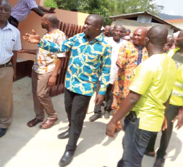 The Lower Manya Krobo Municipal Chief Executive (MCE), Mr Simon Kweku Tetteh, leading some community  leaders to inspect the teachers’ bungalow after the handover