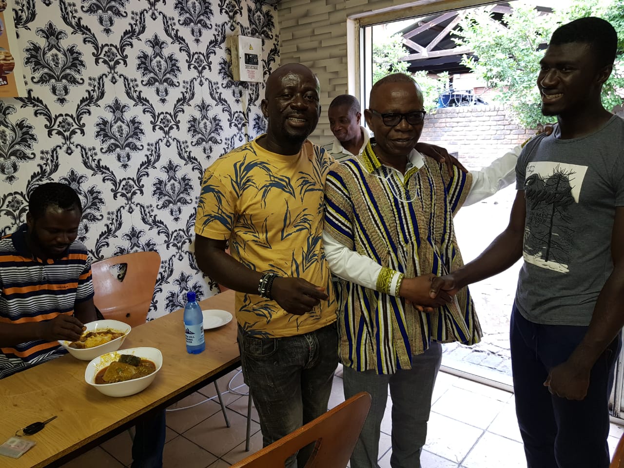 When Mr George Ayisi-Boateng (middle) visited Ghanaians in South Africa at their work places to interact with them