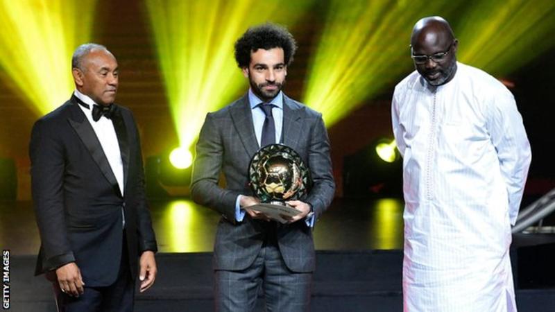 Mohamed Salah was presented with his award by Caf president Ahmad Ahmad (left) and Liberia president George Weah (right)
