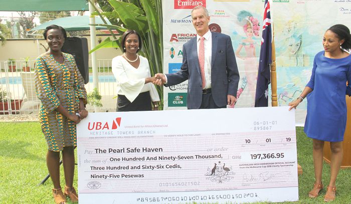 Mr Andrew Barnes (2nd right), the Australian High Commissioner to Ghana,  presenting a dummy cheque to Ms Isobel Acquah (2nd left), the Director of The Pearl Safe Haven project. Picture: EDNA ADU-SERWAA