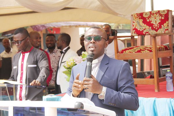 Senior Pastor Isaac Osei Frimpong (right), the District Head Pastor of the Apostles’ Continuation Church International addressing the congregants. Picture: EDNA ADU-SERWAA