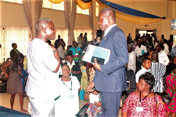  Mr Joseph Boahen Aidoo (right), Chief Executive Officer of Ghana COCOBOD and Mr Alistair Djimatey, Manager, Corporate Affairs of Blue Skies Limited, interacting with participants after the conference. Picture: Maxwell Ocloo