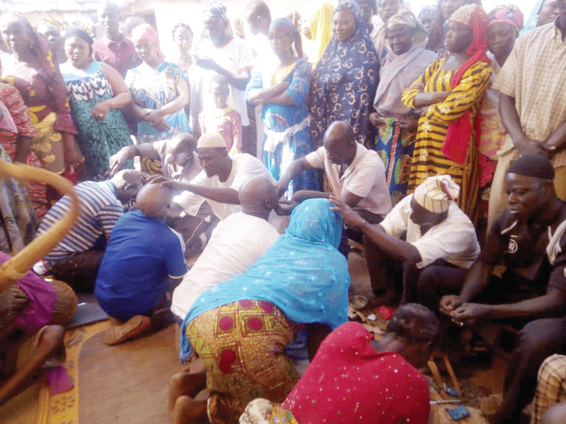The wives and children of the late Yaa Naa Yakubu Andani being shaved as part of the funeral process