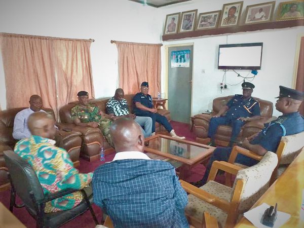 DCOP Francis Ebenezer Doku (2nd right)  in a crisis meeting with members of the security council in Kpando