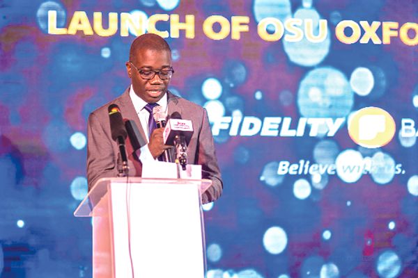 Mr Julian Opuni, Fidelity Bank MD addressing the gathering before the opening of the branch. INSET: The Interior of the Osu branch