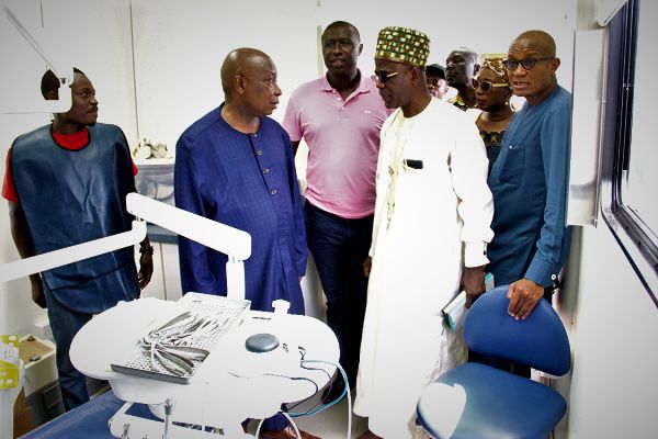 Mr Kwaku Agyemang-Manu (2nd left), Minister of Health interacting with Mr Patrick Boamah (3rd left), MP for Okaikwei Central, Dr Mustapha Abdul-Hamid (right), and other dignitaries at the launch of the programme Picture: EDNA ADU-SERWAA