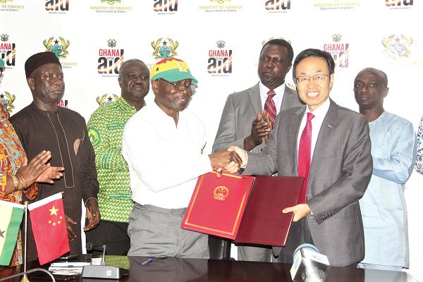 Mr Ken Ofori-Atta (left), Minister of Finance and Mr Shi Ting Wang (right), Chinese Ambassador to Ghana, exchanging the signed documents. Behind them are Prof John Gyapong (2nd left), Vice Chancellor of University of Health and Allied Sciences (UHAS), Dr Yaw Osei Adutwum (middle), a Deputy Minister of Education and Mr Edward Boateng (right), Ghana’s Ambassador to China. Picture: Maxwell Ocloo