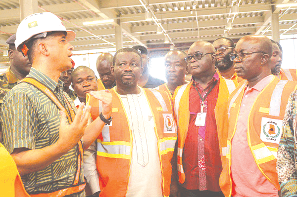Mr Jorge Javares De Almeida (left), Project Director of Contracta Construction Firm, explaining a point to Mr Eric Nana Agyemang Prempeh (2nd left), during a tour of the Kejetia Market project. Those looking on include Mr Assibey Antwi (right) and Mr Emmanuel Danso, a consultant to Contracta. 