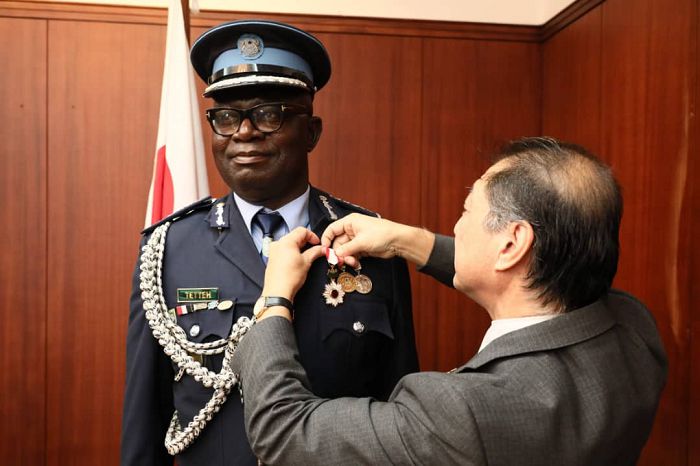 Mr Emmanuel Gidisu Tetteh being decorated with the honours by the Japanese Ambassador to Ghana, Mr Tsutomu Himeno