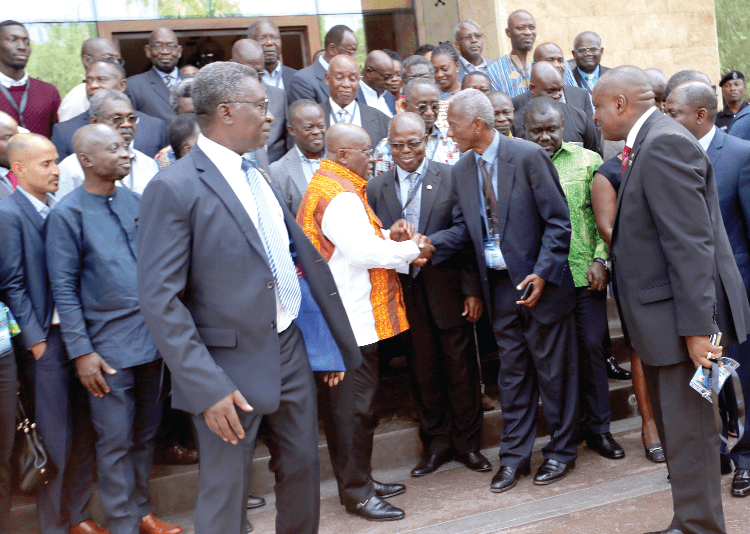 President Akufo-Addo exchanging pleasantries with Mr Kwame Pianim (2nd right), an economist, while Prof. Kwabena Frimpong-Boateng (left), Mr Kwabena Agyapong and others look on. Picture: SAMUEL TEI ADANO