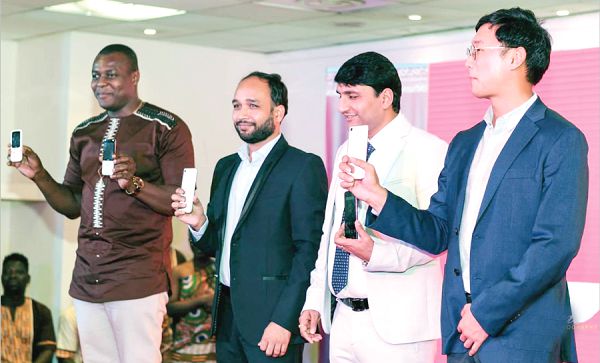 Mr Rahul Kumar Singh (2nd left), Mr Saurabh Verma (3rd left) and other dignitaries displaying the new range of mobile phones.