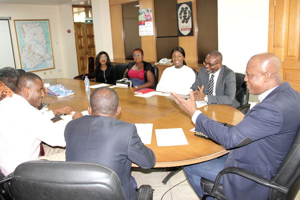  Mr Ato Afful (right), Managing Director, Graphic Communications Group Limited (GCGL) holding discussions with the GLICO delegation. Picture: EDNA ADU-SERWAA