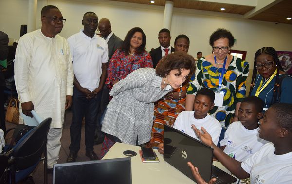 The Director-General of UNESCO, Madam Audrey Azoulay, inspecting some of the works by the beneficiaries of the Girls Can Code Project
