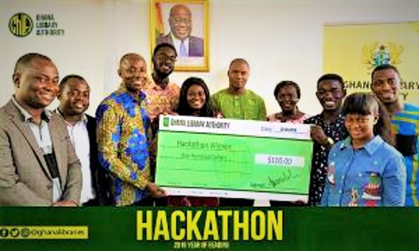  Humphrey Asigbe, third right, being presented with a replica cheque for his prize