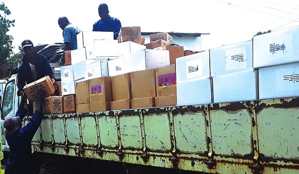 Staff of the directorate loading boxes of the chemicals to augment the stock in the northern sector of the country
