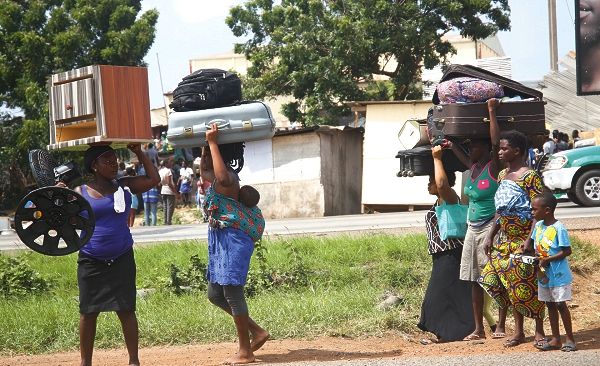 Some of the squatters evacuating their belongings during the demolition exercise by a taskforce from the Ayawaso West Municipal Assembly and the police