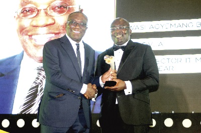 Vice-President Dr Mahamudu Bawumia (right) presenting the outstanding contribution to public sector award to Mr Kwasi Agyeman Dua Busia at the awards ceremony in Accra.