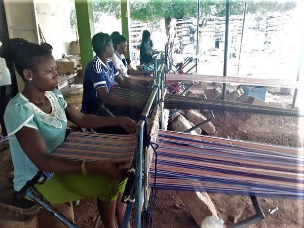 Young women at a weaving centre