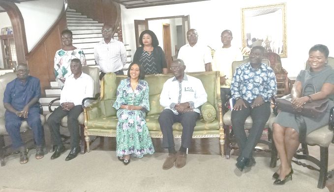  Former President Kufuor (3rd right, seated) and Mrs Jean Mensa (3rd left, seated). With them are other officials from the EC