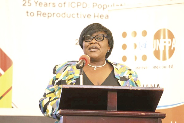 Ms Marian Kpakpah (left), Chief Director of the Ministry of Planning, addressing the participants in the forum