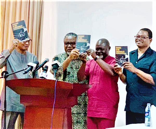 Azumah Nelson (right) is joined by Prof. Kofi Anyidoho and Dr Mustapha Abdul-Hamid (left) to launch the book