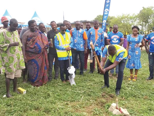 Mr Shine Akiem Torsoo, the Marketing Manager of PGL digging the ground with a pick-axe to signify the start of the project