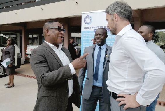 Dr Micheal Tanu (left) interacting with Mr Mike Dean Moriarty