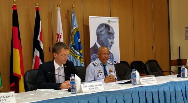Air Vice-Marshal Griffiths Santrofi Evans (right) addressing the forum. With him is Mr Hans-Helge Sander
