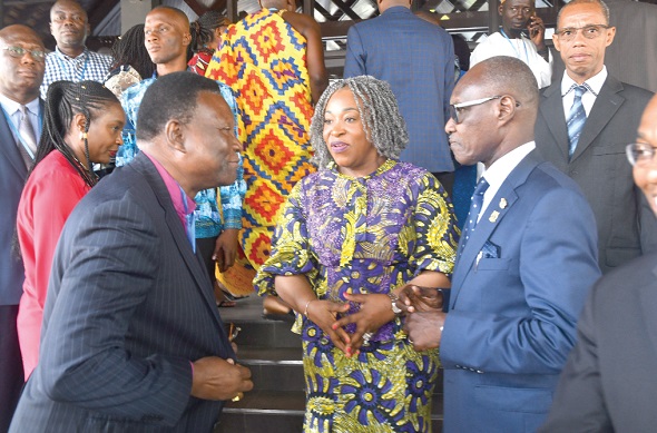 The Most Rev. Professor Emmanuel Asante (left)  interacting with Ms Shirley Ayorkor Botchway (middle), the Minister of Foreign Affairs and Regional Integration, and Mr Robert Poku Kyei, Technical Advisor at the Office of the Senior Minister, after the opening session in Accra. Picture: Emmanuel Quaye 
