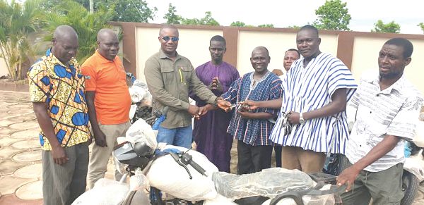 Mr Jinapor (3rd left), MP for Yapei-Kusawgu, handing over the motorbikes to Mr Duubik (arrowed), Central Gonja District  Director for Health Service
